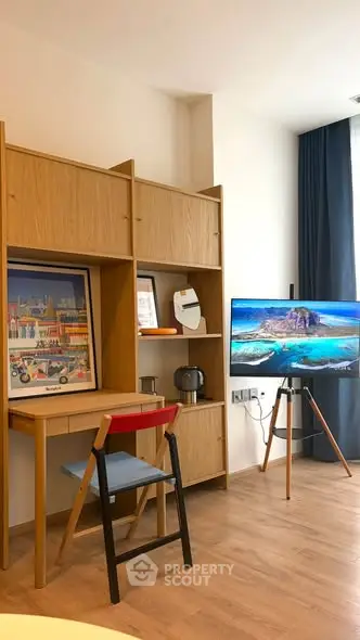 Modern living room with stylish wooden furniture and flat-screen TV, perfect for cozy urban living.