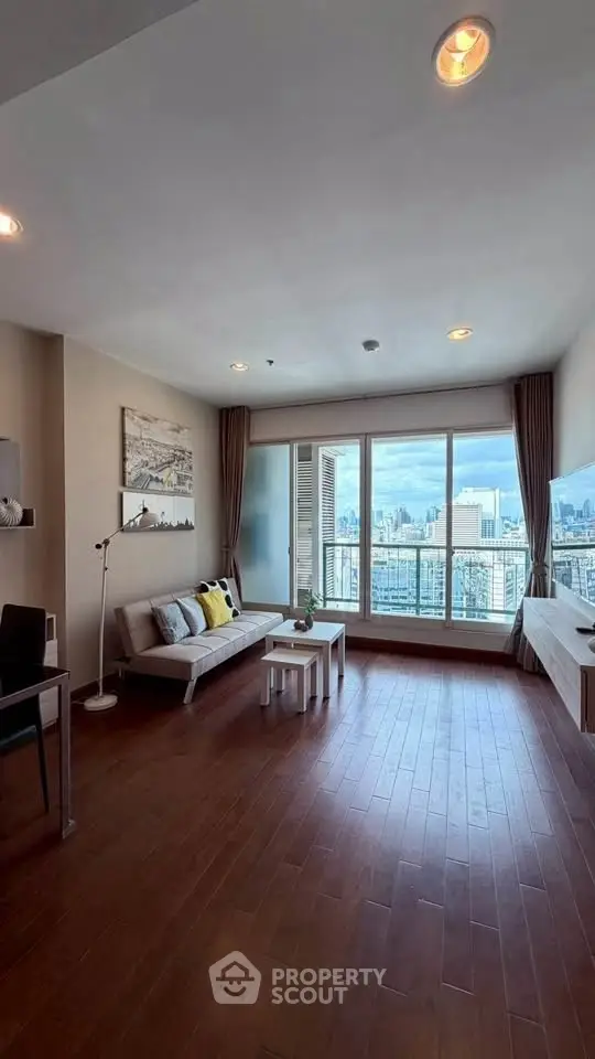 Spacious living room with stunning city view and modern decor