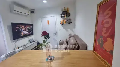 Cozy living room with modern decor and wall-mounted TV