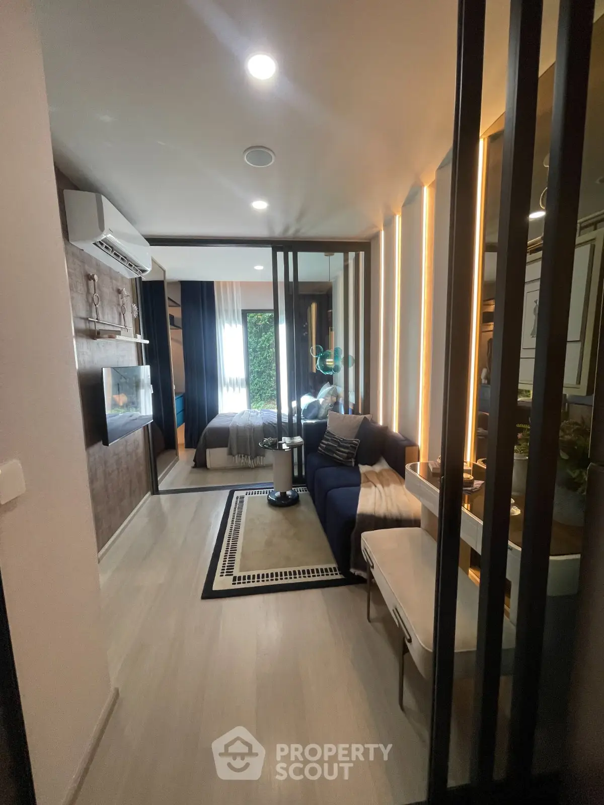Modern living room with stylish decor and natural light in a contemporary apartment.