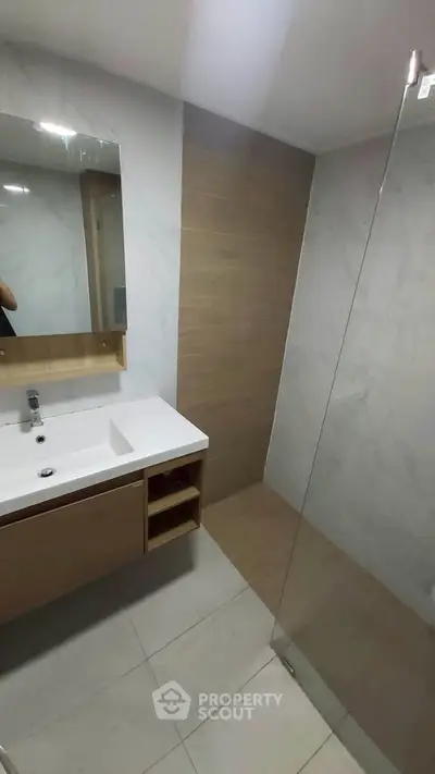Modern bathroom with sleek design and glass shower enclosure