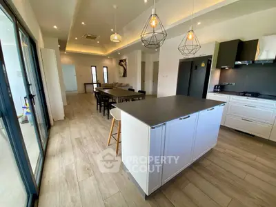 Spacious modern kitchen with island and open layout in luxury home