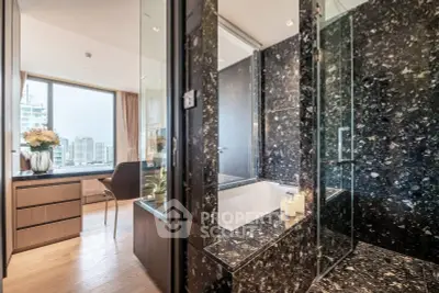Luxurious bathroom with marble finishes and city view from adjacent room