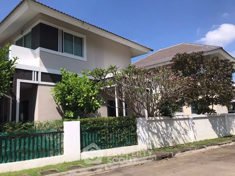 Charming suburban house with lush greenery and modern design