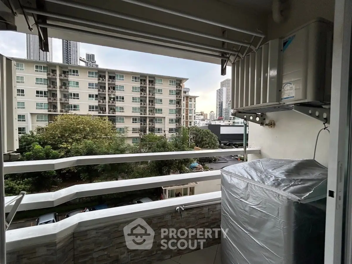 Charming balcony with city view, perfect for relaxation and enjoying urban living.