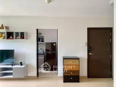 Modern living room with sleek furniture and open kitchen view