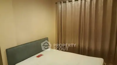 Cozy bedroom with minimalist design and elegant curtains