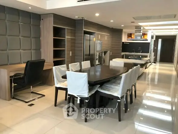 Spacious modern kitchen with dining area and sleek design