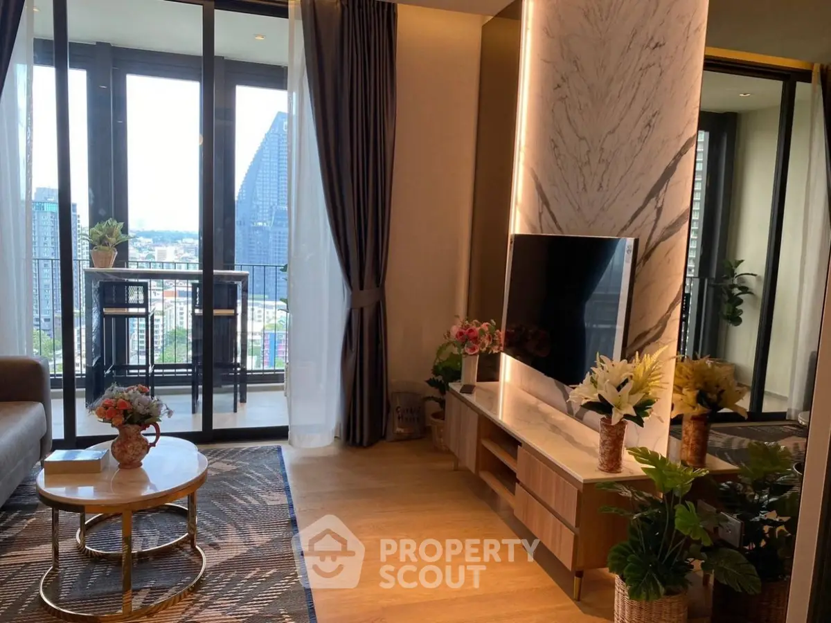 Luxurious living room with modern decor and stunning city view from balcony.