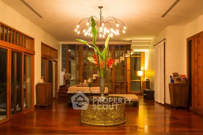 Luxurious living room with elegant wooden flooring and modern chandelier