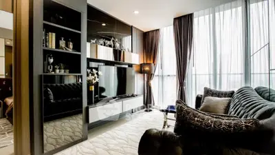 Luxurious modern living room with elegant decor and large windows