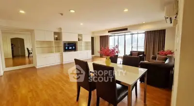 Spacious living room with modern furniture and large windows for natural light.