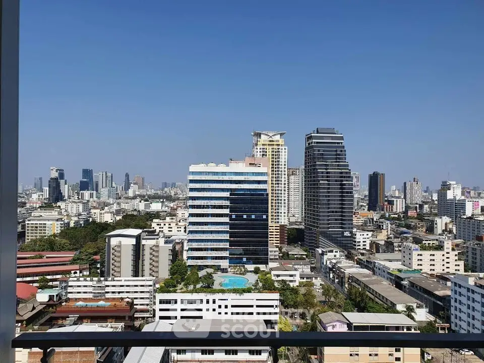 Stunning cityscape view from a high-rise balcony showcasing urban skyline and modern architecture.