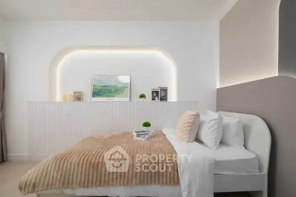 Luxurious modern bedroom with elegant lighting and cozy decor