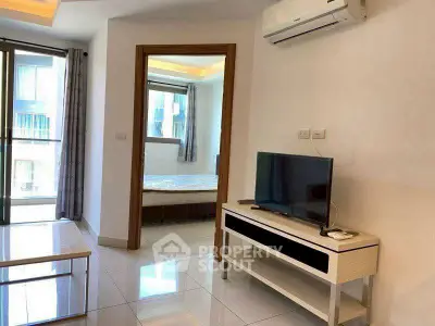 Modern apartment interior with sleek furniture and natural light, featuring a cozy living area and bedroom view.