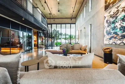 Stunning modern living room with high ceilings and large windows