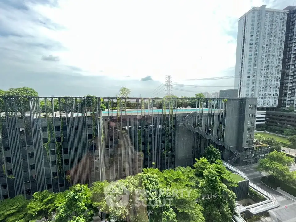 Stunning urban view with modern high-rise buildings and lush greenery.