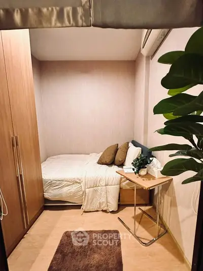 Cozy small bedroom with modern decor and wooden wardrobe