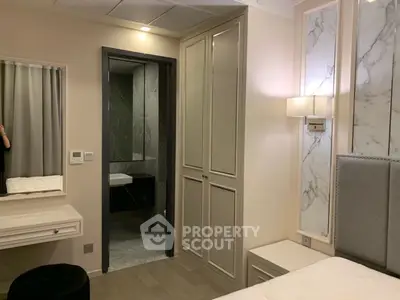 Elegant bedroom with ensuite bathroom and stylish decor