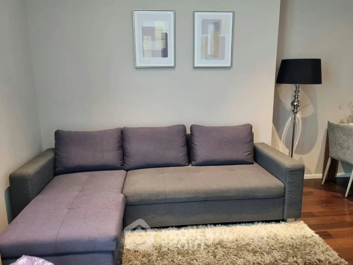 Modern living room with stylish gray sofa and elegant decor
