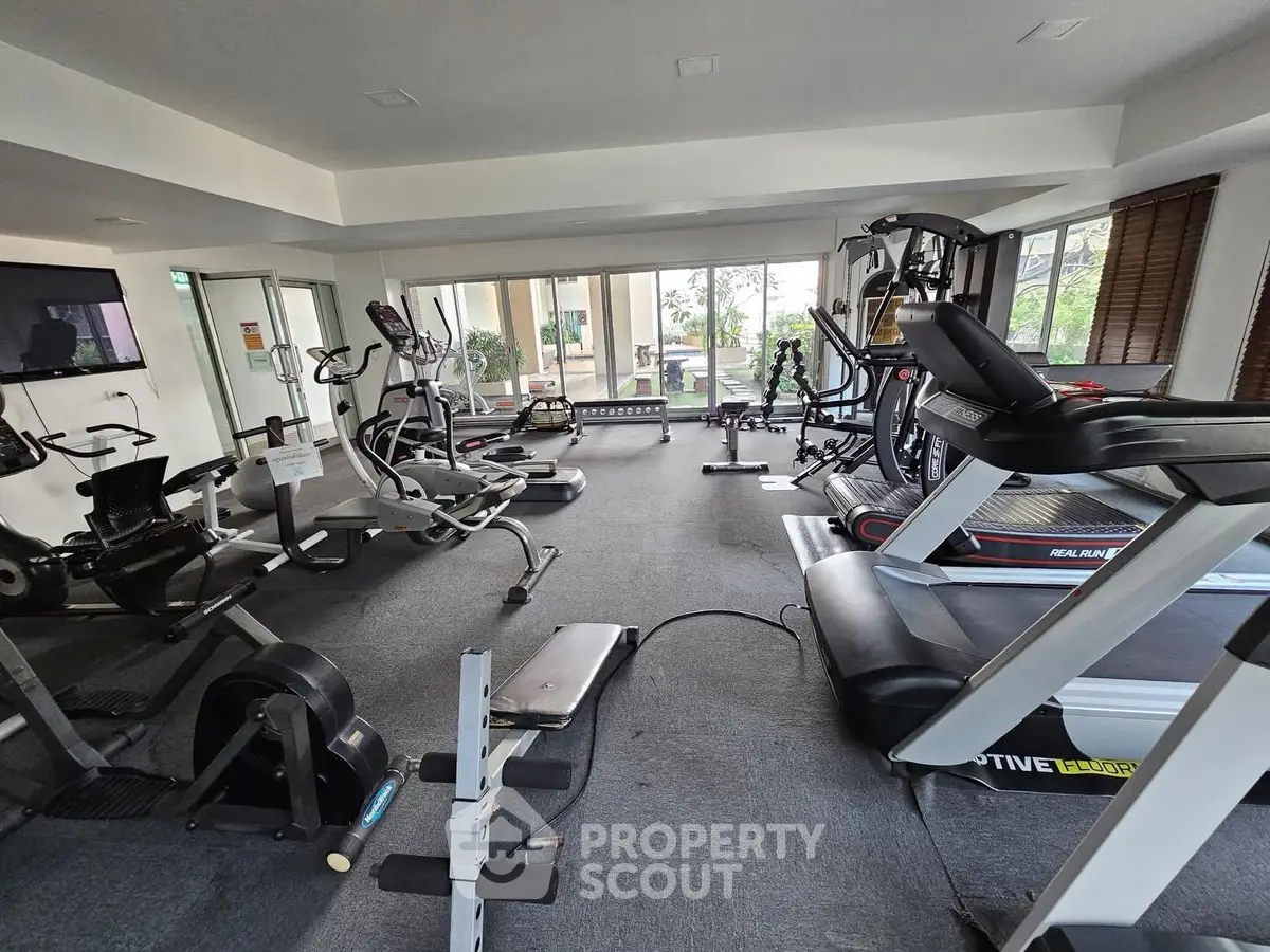 Modern gym with state-of-the-art fitness equipment in a residential building.