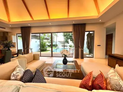 Luxurious living room with pool view and elegant decor