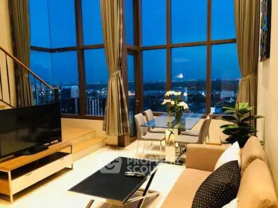 Luxurious high-rise living room with stunning city view and elegant decor.