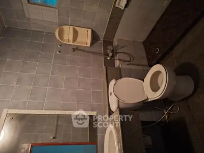 Spacious bathroom with modern fixtures and elegant tile design