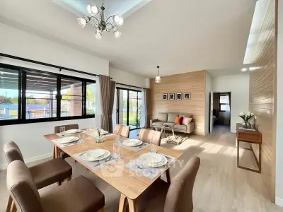 Modern open-plan living and dining area with stylish decor and natural light.