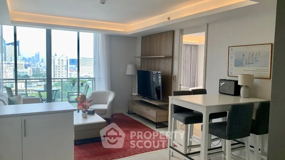 Modern living room with city view, stylish furniture, and open layout in urban apartment.