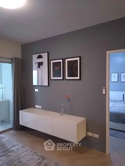 Stylish modern living room with elegant wall art and sleek furniture design.