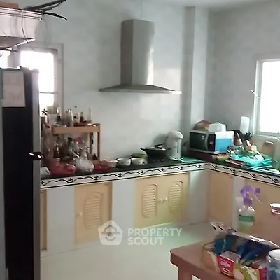 Cozy kitchen with modern appliances and ample counter space for culinary creativity.
