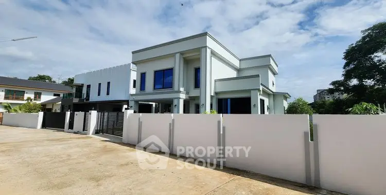 Modern luxury house with sleek design and spacious layout in a serene neighborhood.