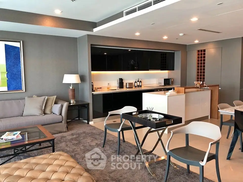 Luxurious open-plan living room with modern kitchen and stylish decor
