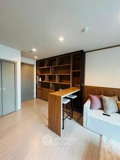 Modern living room with stylish wooden shelving and cozy seating area