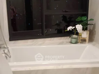 Luxurious bathroom with elegant bathtub and city view window