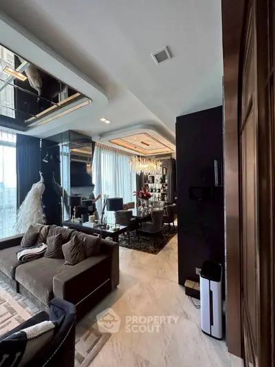 Luxurious living room with elegant decor and floor-to-ceiling windows offering stunning views.