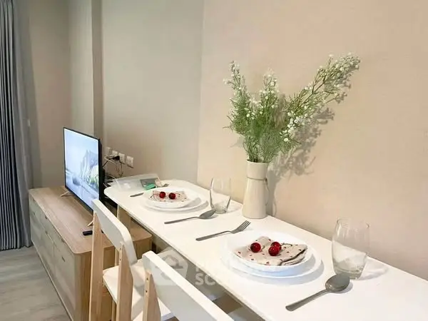 Modern dining area with minimalist decor and elegant table setting