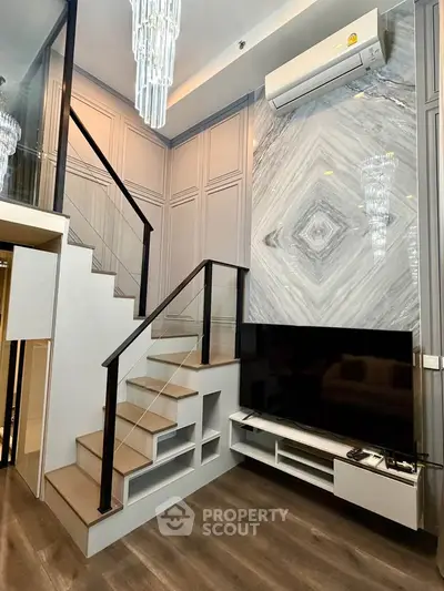 Modern duplex living room with elegant staircase and stylish decor