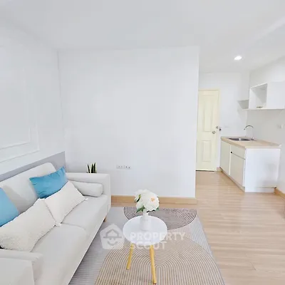 Bright and modern living room with cozy sofa and stylish decor