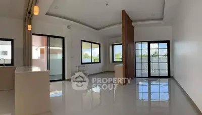 Spacious modern living room with large windows and sleek design