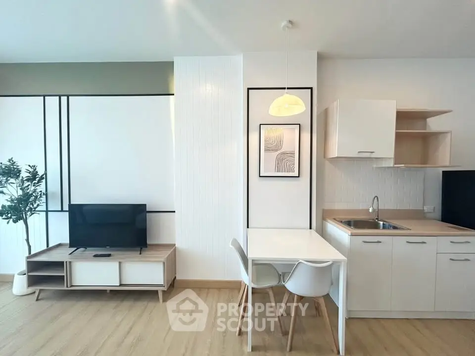 Modern living room with sleek furniture and open kitchen layout