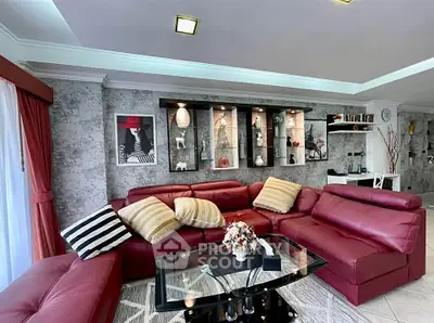 Luxurious living room with red leather sectional sofa and modern decor