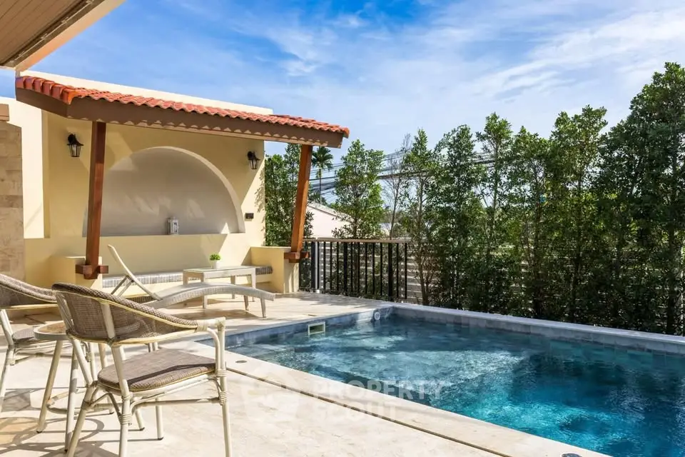 Luxurious private pool area with stylish patio furniture and lush greenery.