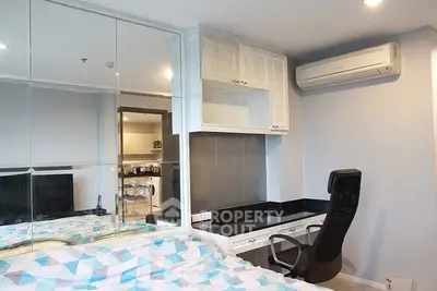 Modern bedroom with built-in desk and air conditioning in stylish apartment