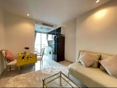 Chic modern living room with cozy dining area and in-unit laundry, perfect for urban living.