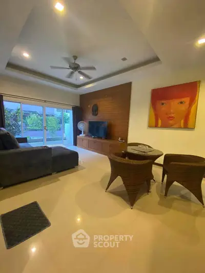 Spacious living room with modern decor and garden view