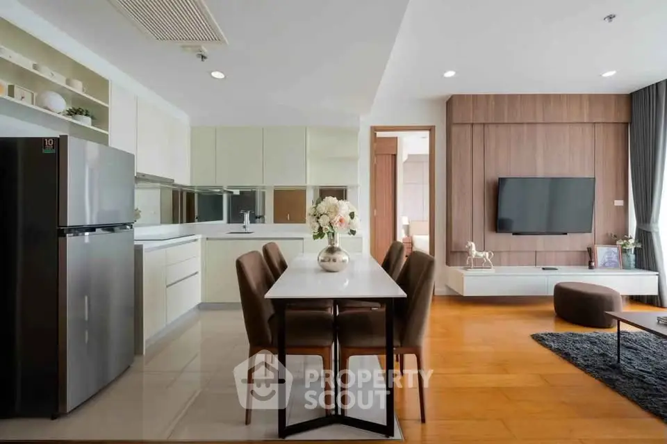 Modern open-layout kitchen and dining area with sleek design and stylish decor