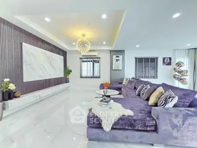 Luxurious modern living room with plush purple sofa and elegant decor