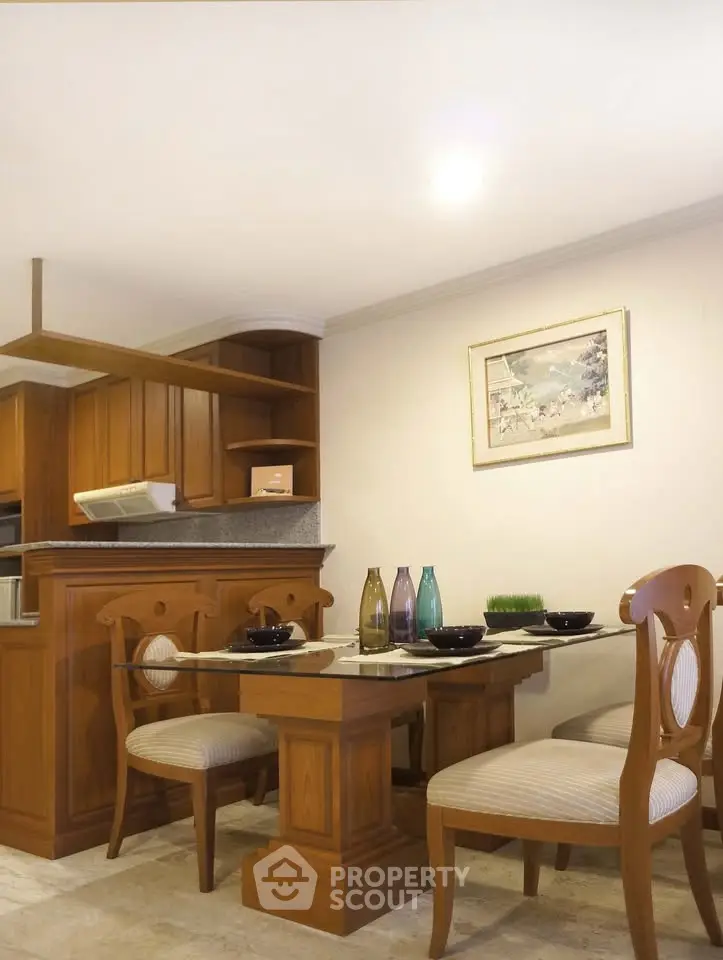 Charming dining area with wooden furniture and elegant decor in a cozy kitchen setting.